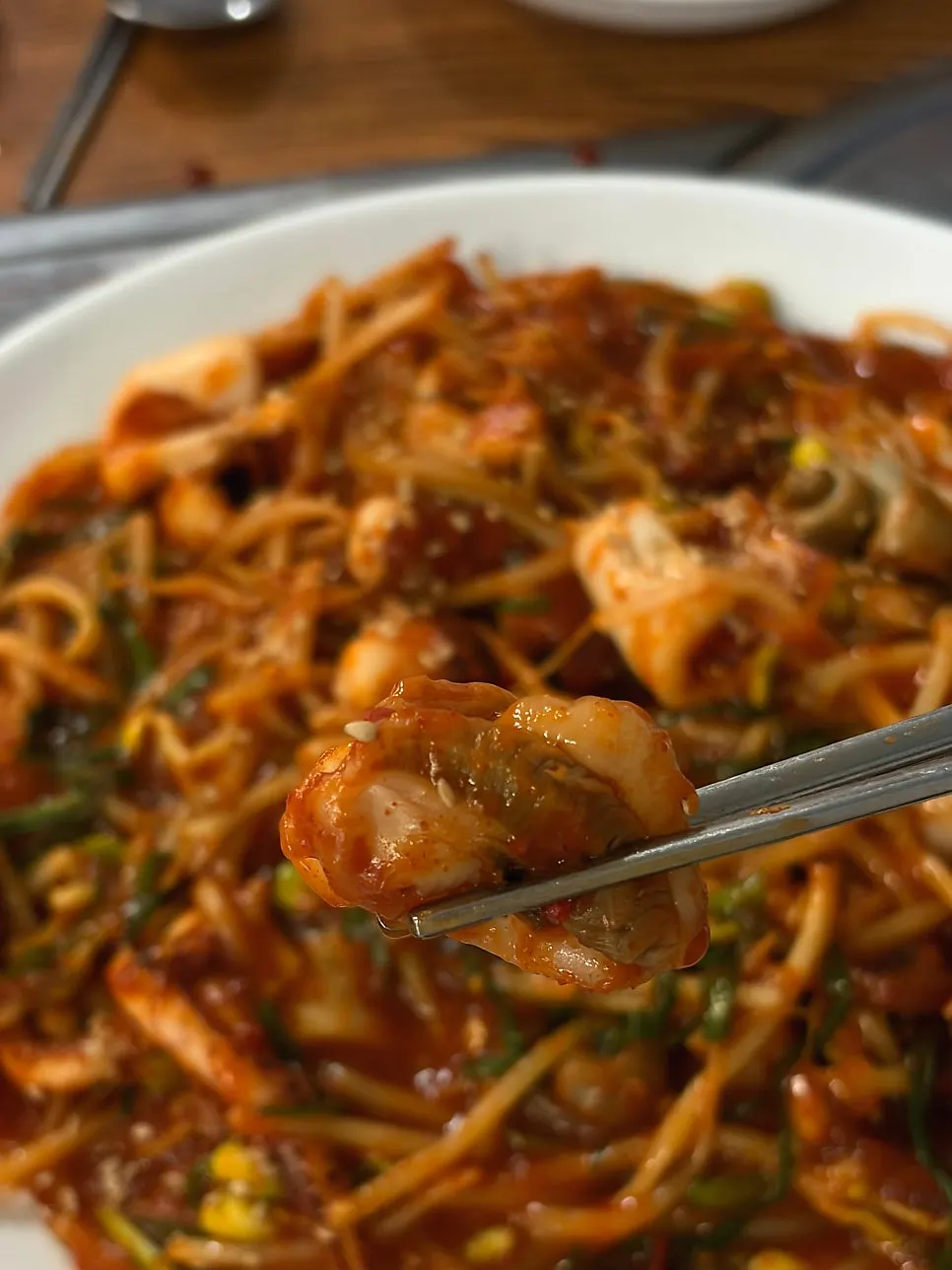 Bean sprouts from the haemuljjim soaked in spicy-sweet sauce