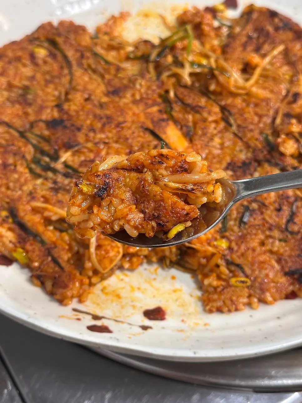 A crispy piece of pressed fried rice