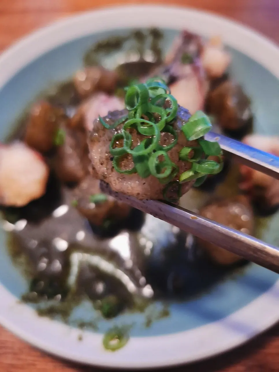 Potato dumplings served with seaweed sauce