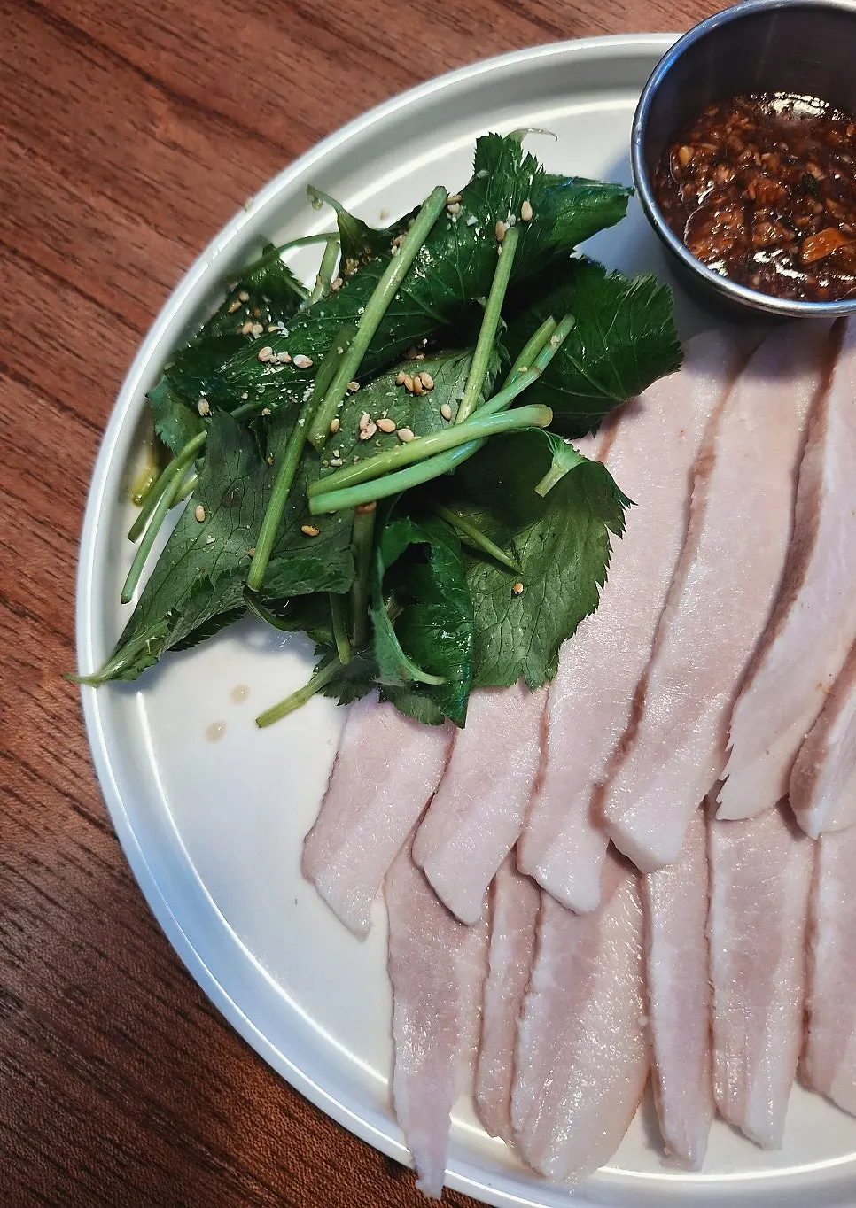 Chilled pork jowl topped with minari