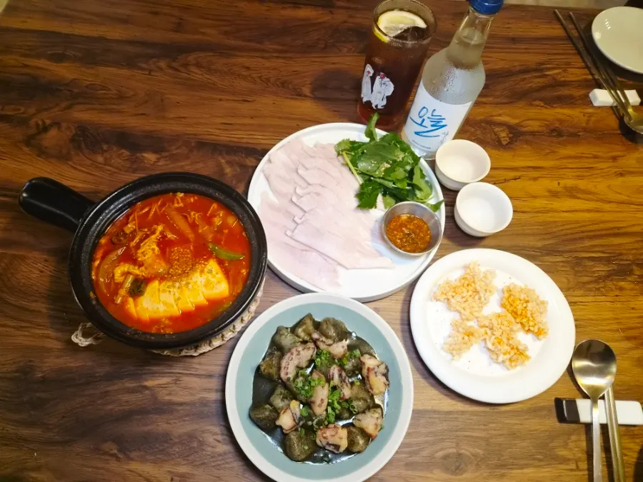 A spread of small plates and traditional liquor at Jumak Inho
