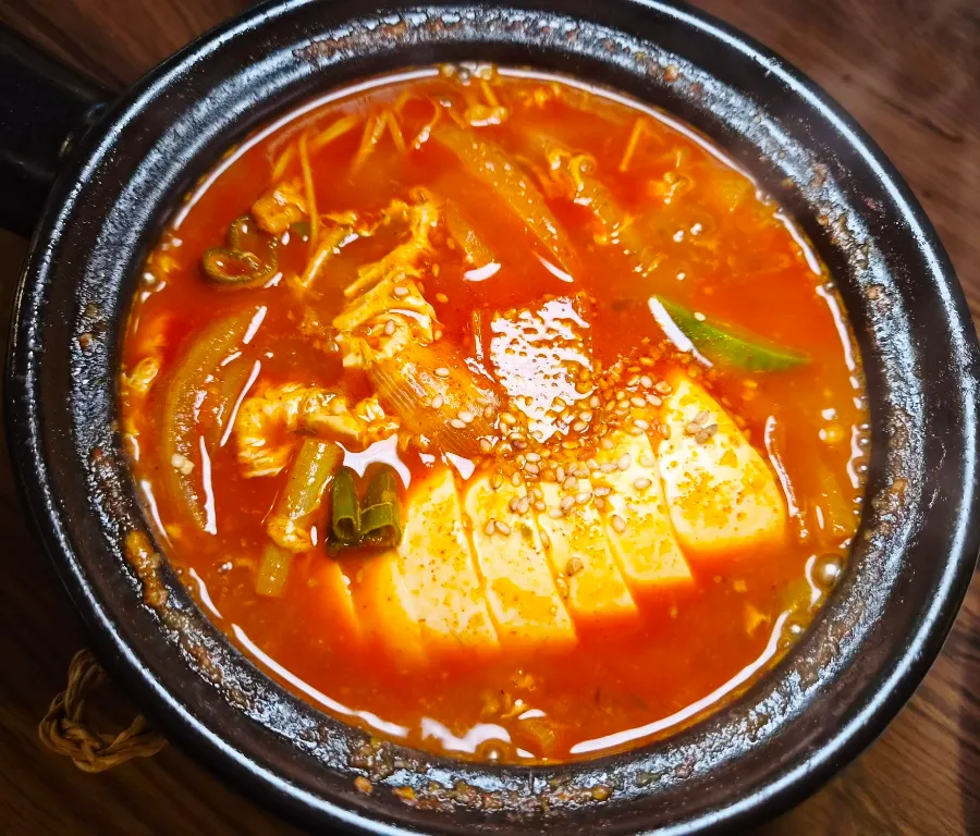 Soft tofu stew with a deep red broth