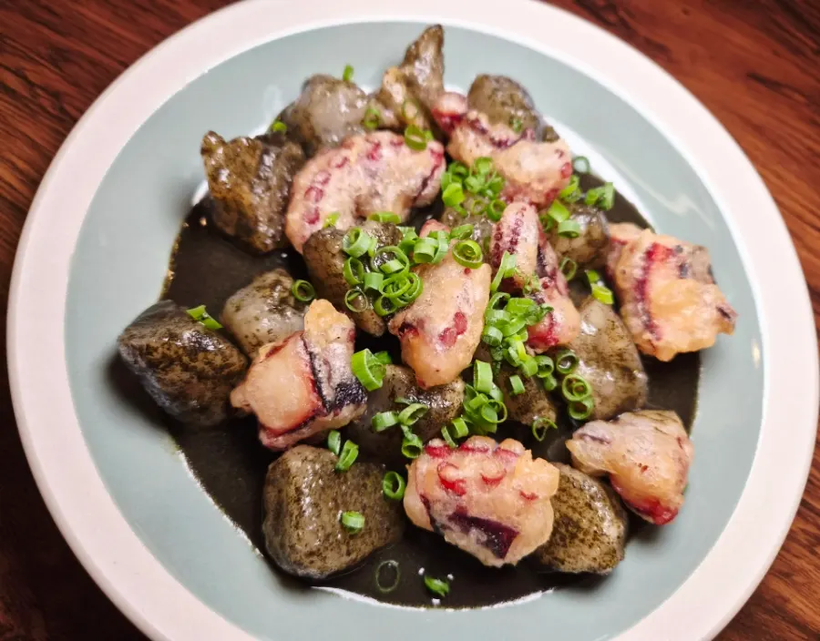 A plate of octopus tempura and potato dumplings