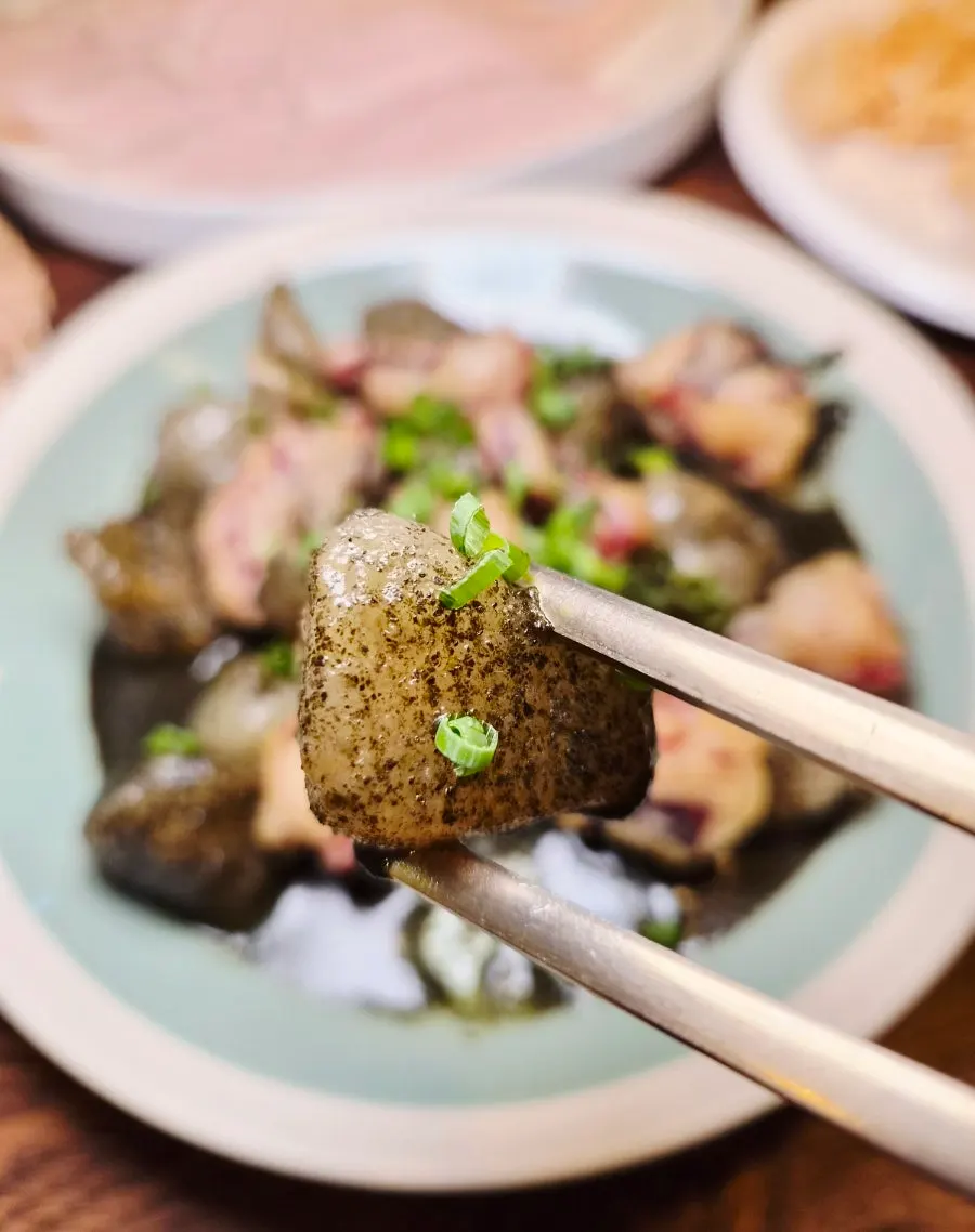 Octopus tempura dipped in laver-based sauce