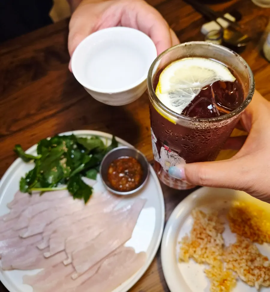 Final spread of small plates and traditional liquor at Jumak Inho