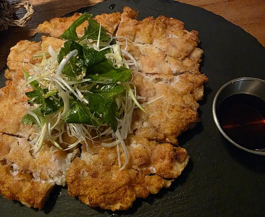 Anju paired with a glass of traditional liquor at Jumak Inho