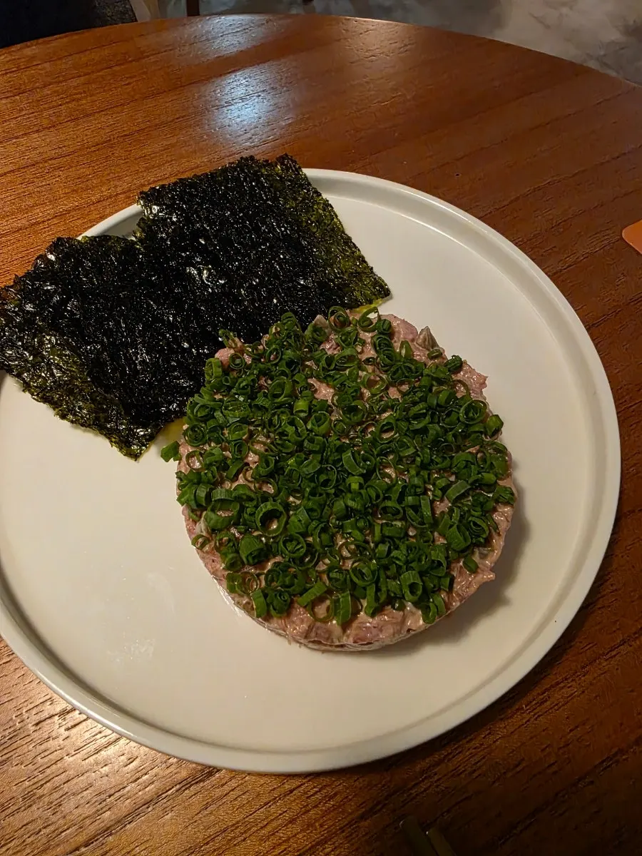 Vertical photo of makgeolli and anju at Jumak Inho