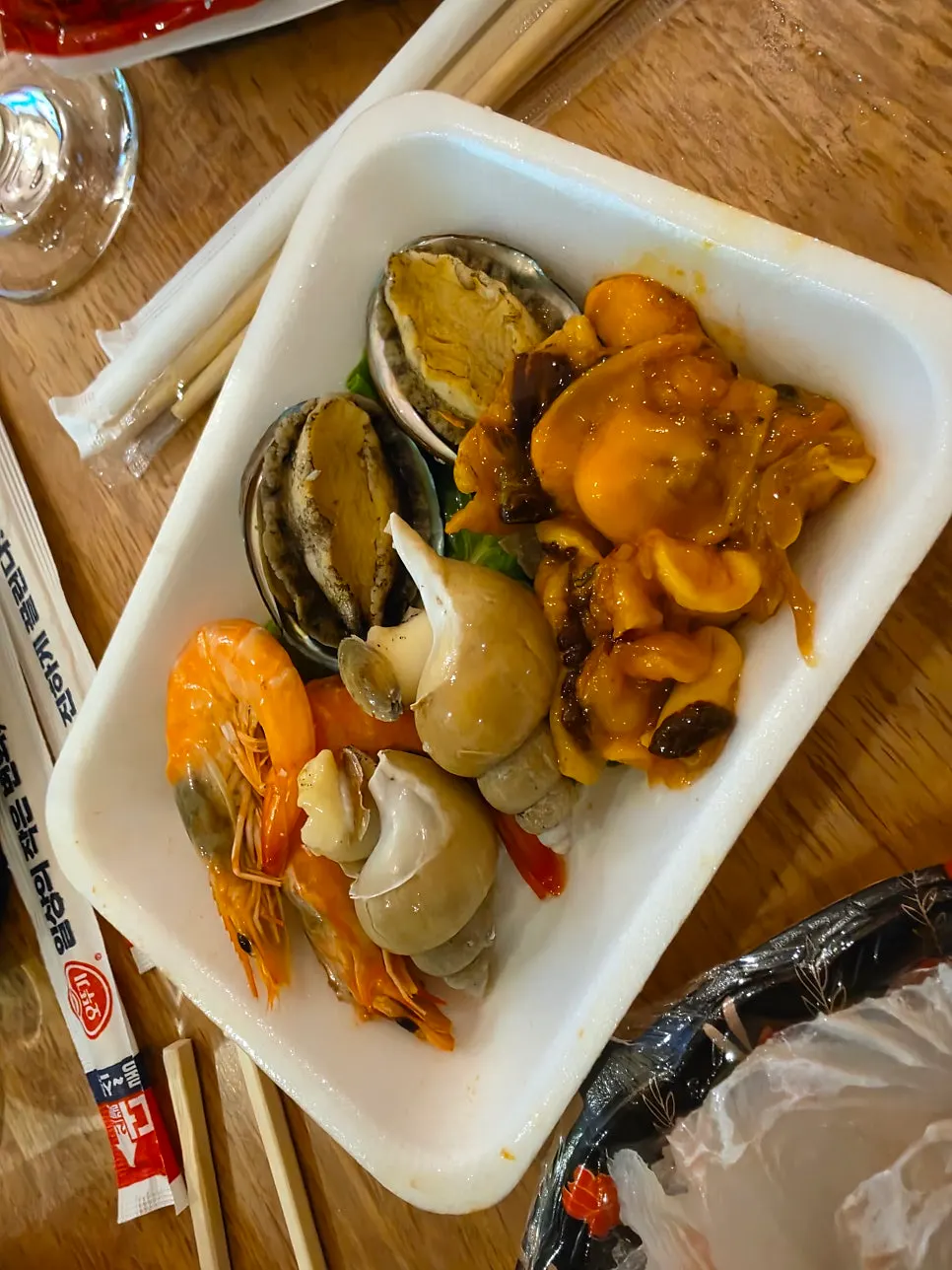 Free seafood served alongside the sashimi