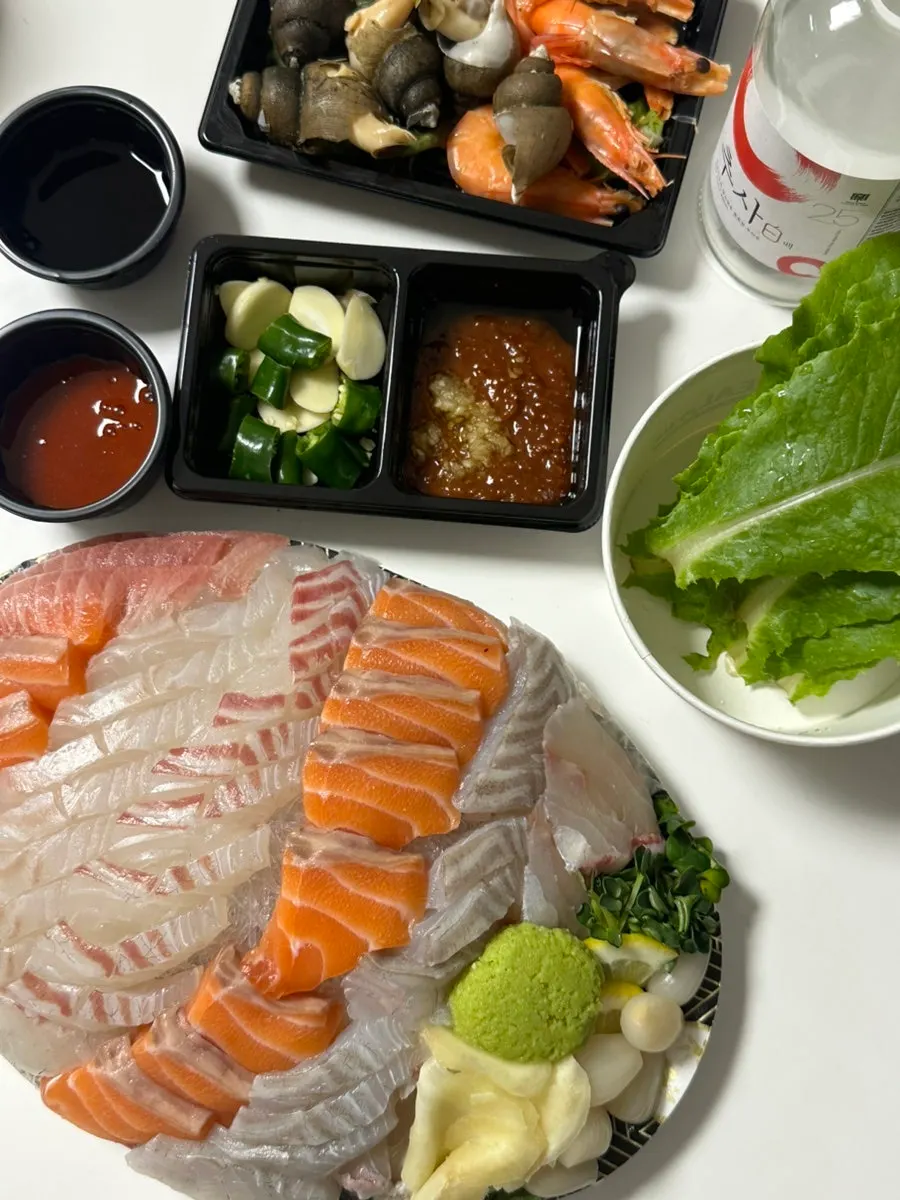 Generous spread of assorted sashimi laid out at the accommodation