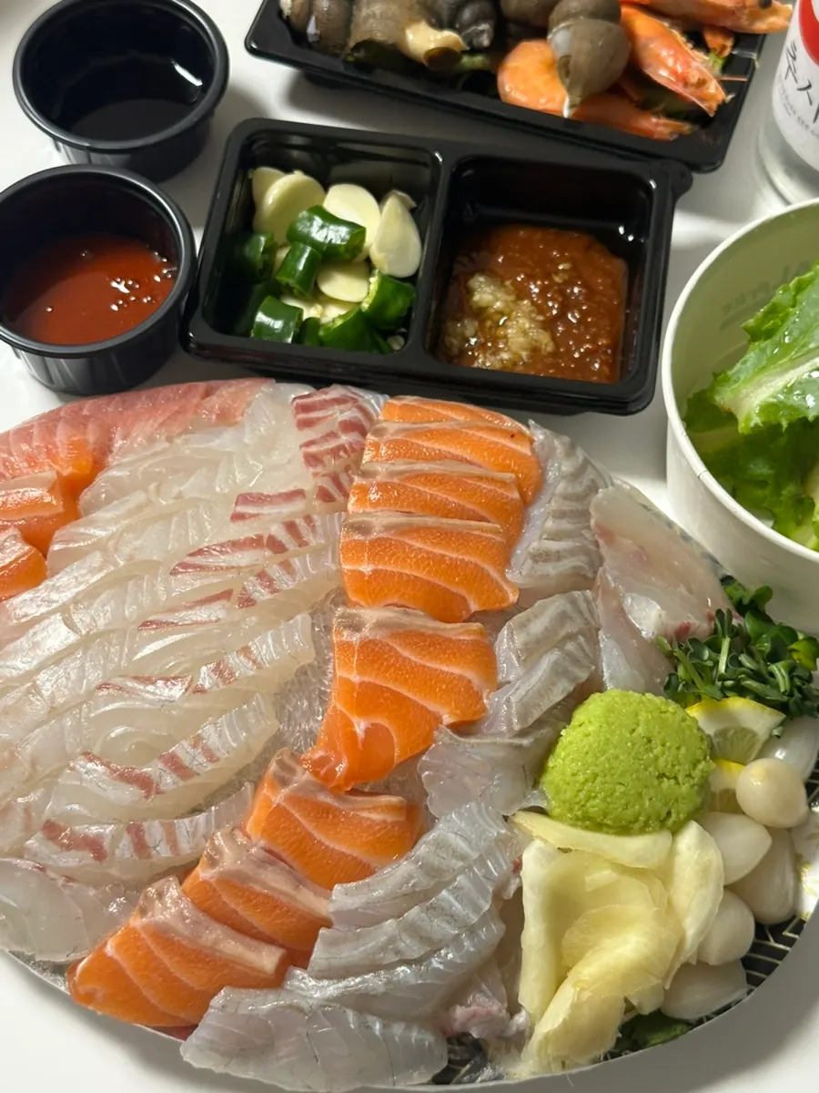 Plate of thickly sliced assorted sashimi