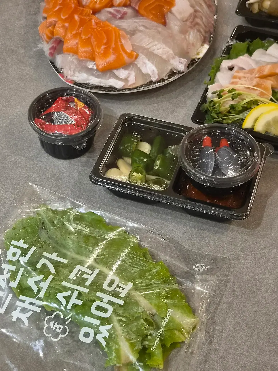 Full shot of the sashimi platter with side dishes