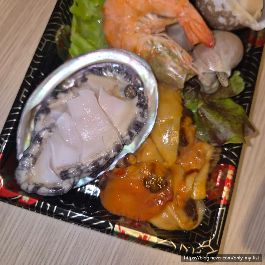 Sea squirt, whelk, abalone, and steamed shrimp seafood