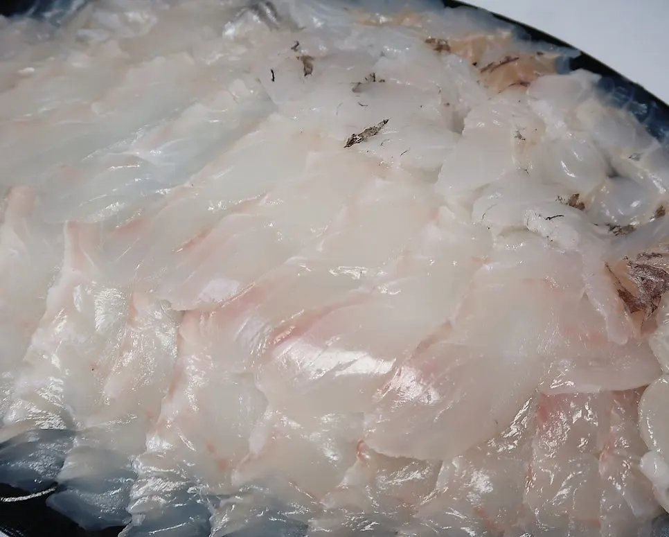 Plate holding both halibut and rockfish sashimi