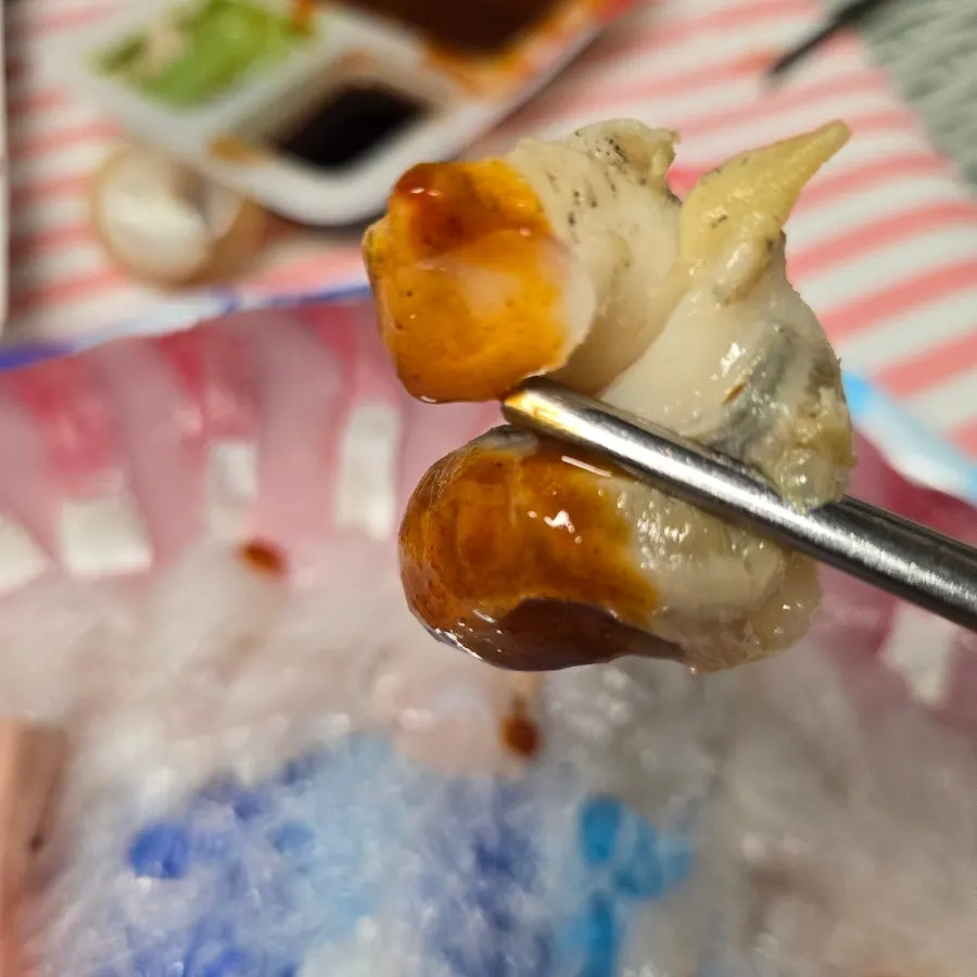 One bite of sashimi with ssamjang