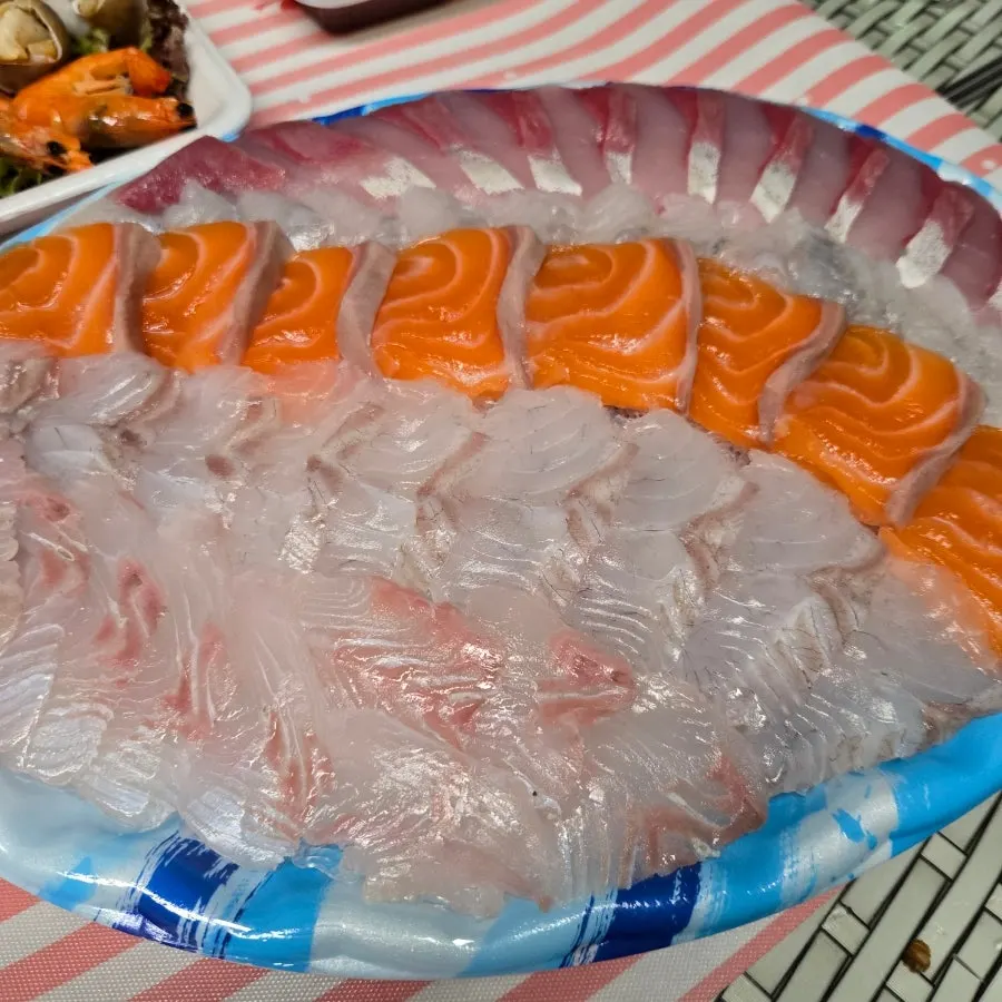 Seafood served alongside sashimi