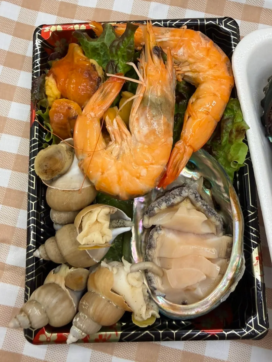 Ramyeon, bean sprouts, and seafood prepped for cooking