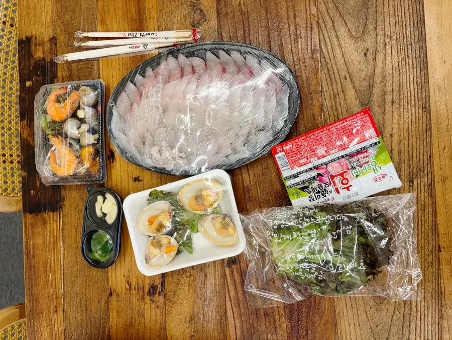Takeout sashimi platter set up on the table at the accommodation