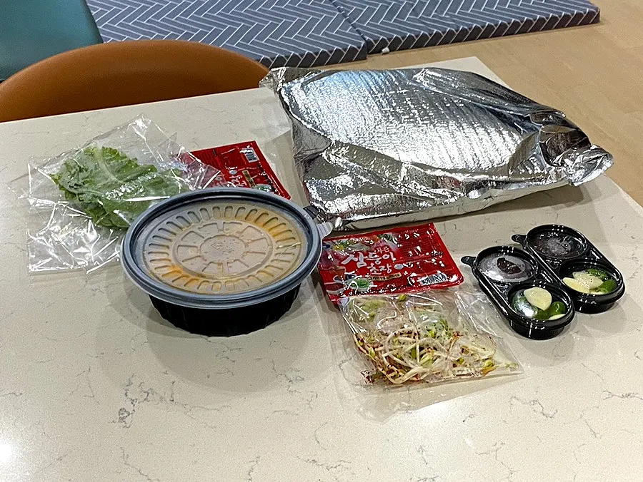 Full sashimi takeout spread laid out at the lodging