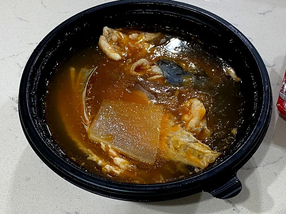 Half-prepped spicy fish stew ingredients as received