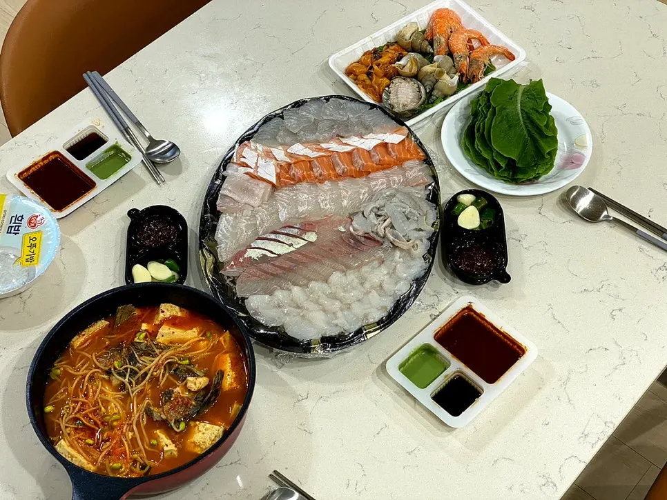 Finished stew with tofu set alongside the sashimi platter