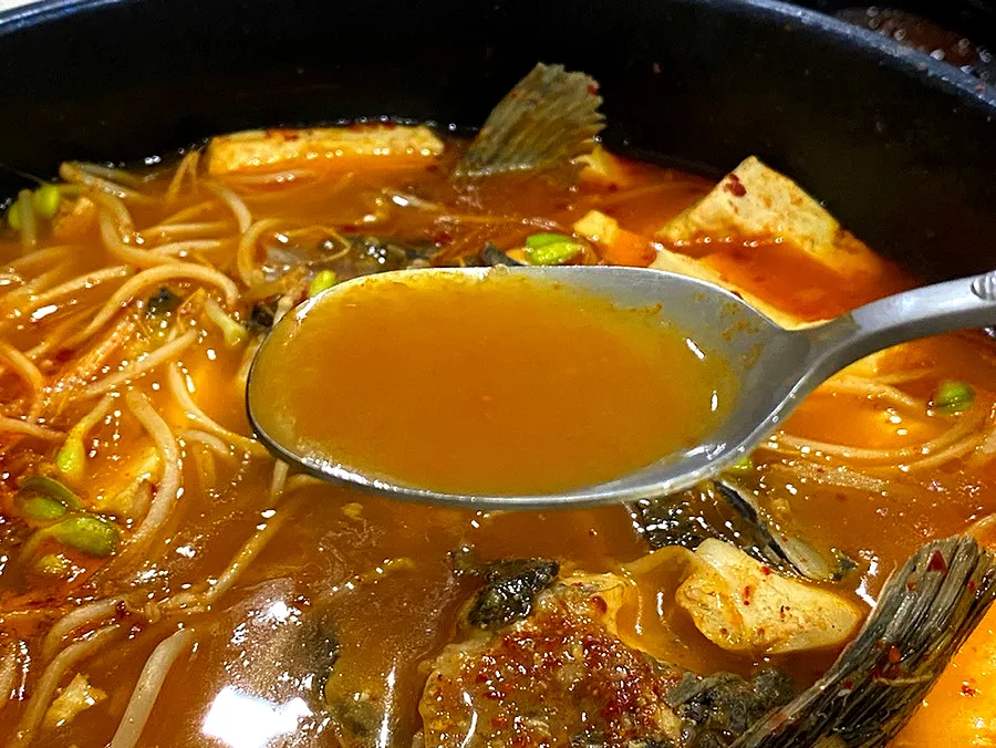 Spicy fish stew with bean sprouts and fish bones