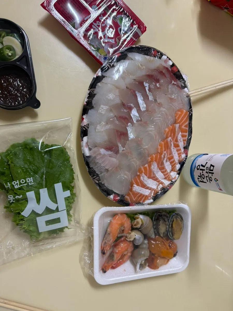 A plate packed full of mixed sashimi
