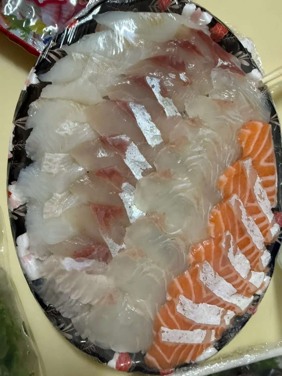 Salmon sashimi packed along with the mixed sashimi