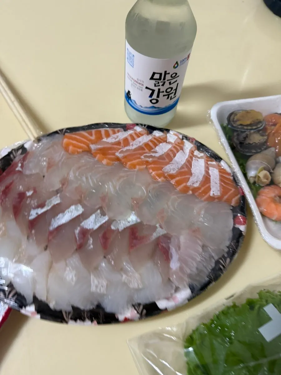 Full sashimi takeout spread laid out at the accommodation