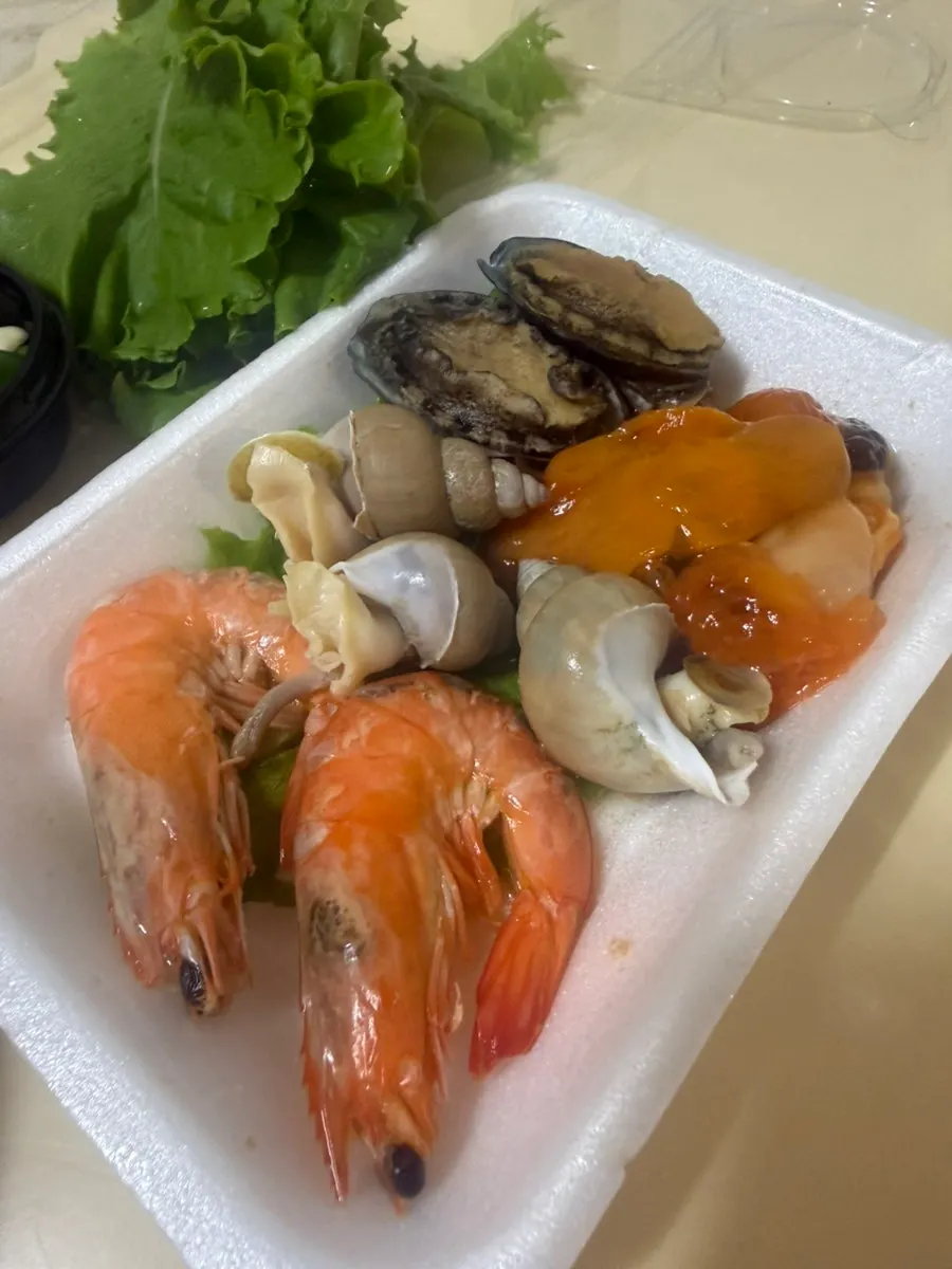 Plate of abalone, shrimp, and whelk