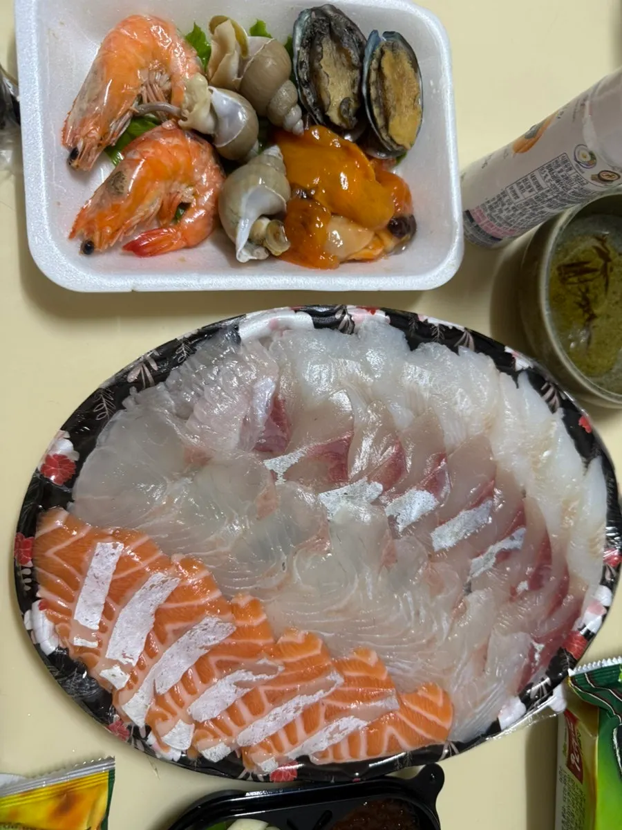 Sashimi spread complete with lettuce wraps and sauces