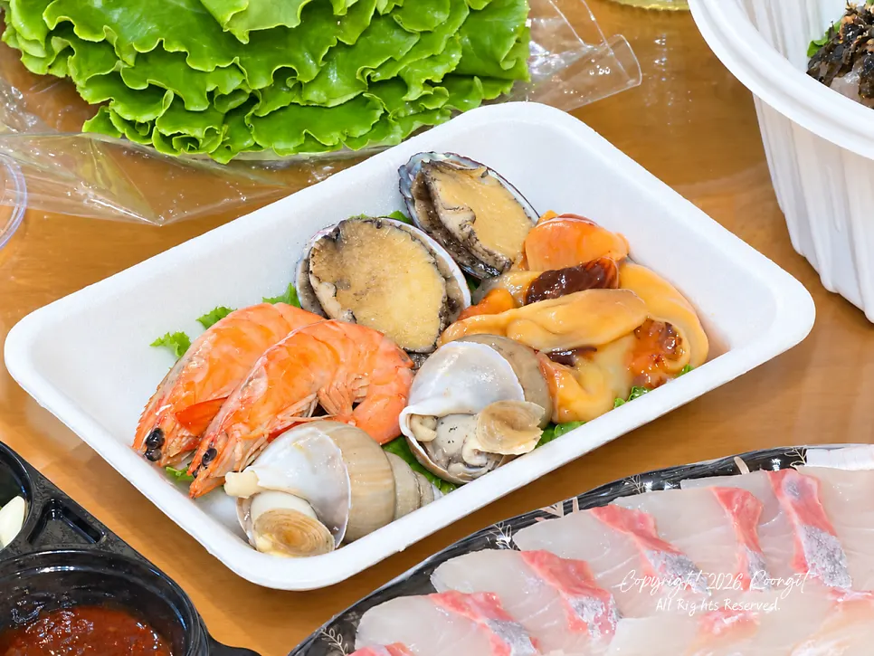 Sauce and vegetables served alongside the sashimi