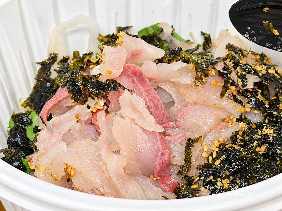 Sashimi, vegetables and sauce for the rice bowl