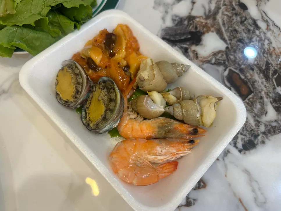 Sashimi takeout set with lettuce wraps and sauces
