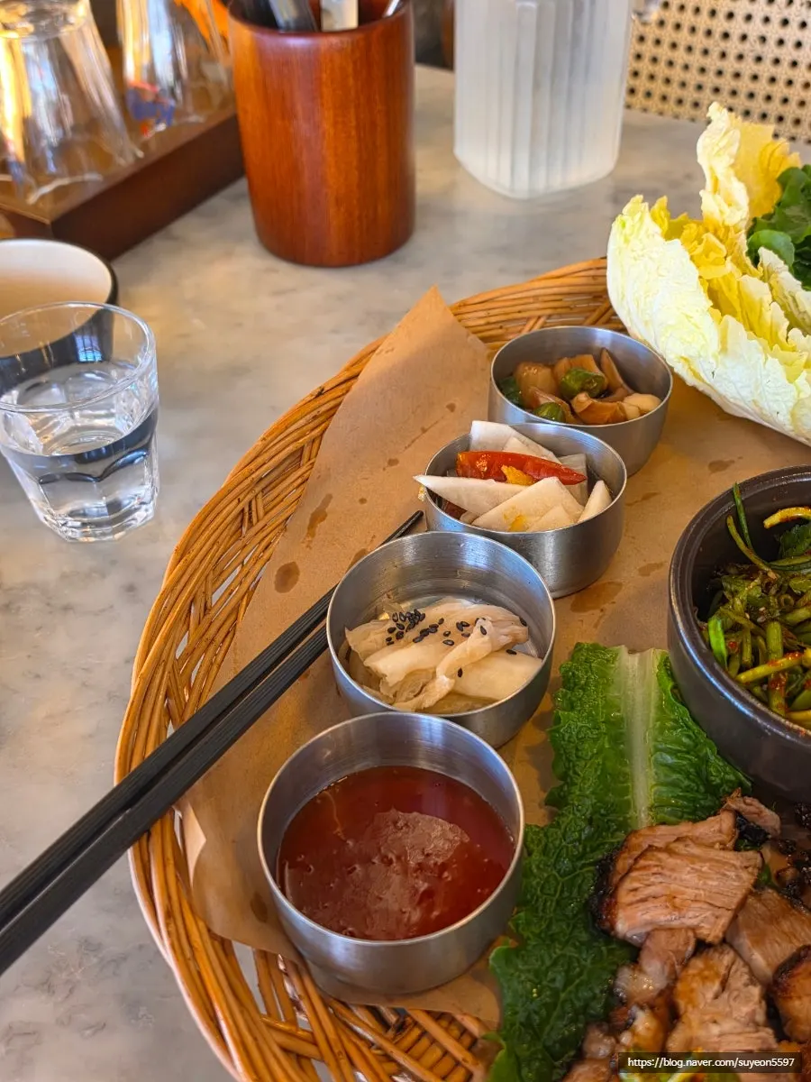Plate of straw-fire char siu bossam and aged seasoned galbi