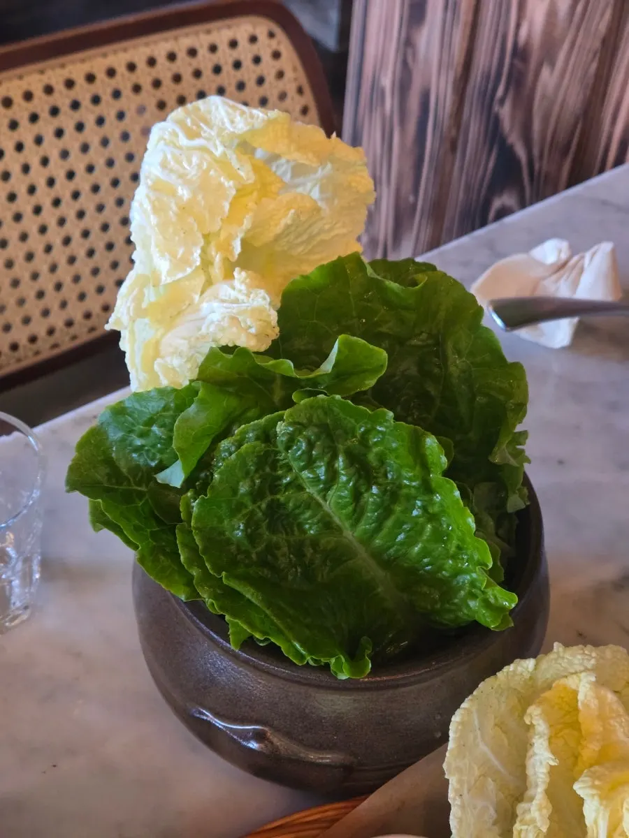 Char siu wrapped with bibimbap in a lettuce wrap