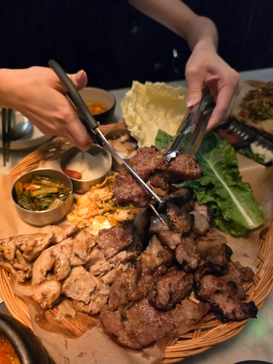 Close-up of pre-cooked meat and side dishes
