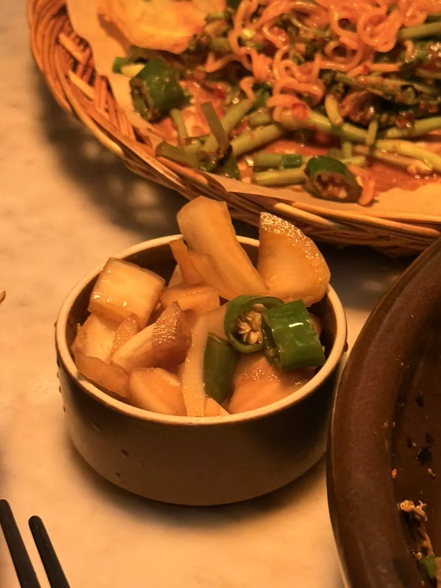 Pickled onions served alongside the meal