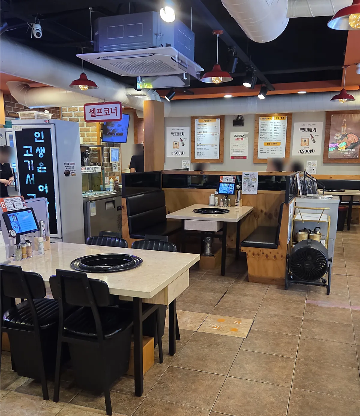 Dining hall with wide table spacing and group seating