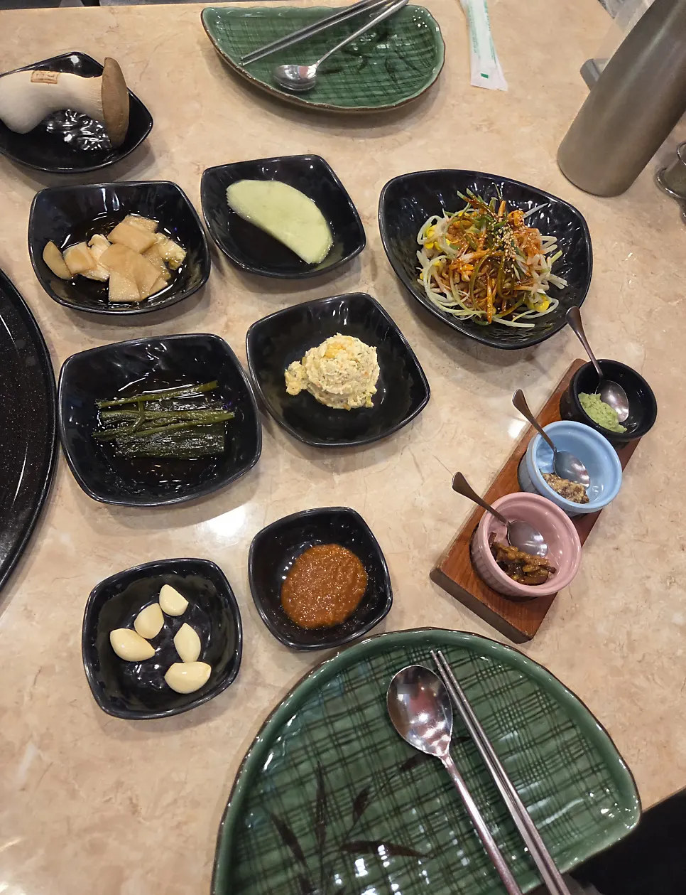 Basic table setting with a half-moon plate and utensils