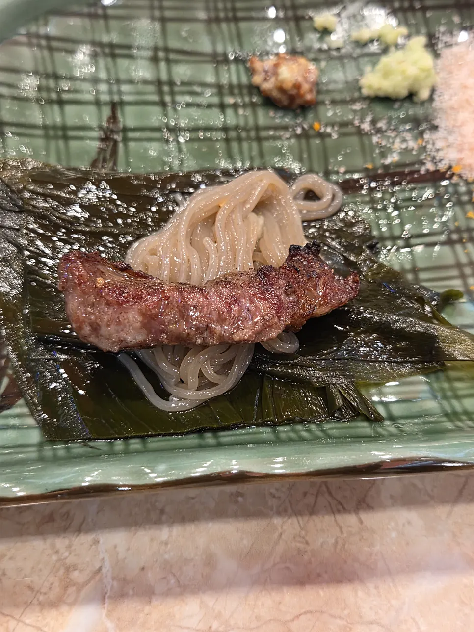 Bibim naengmyeon topped with sauce