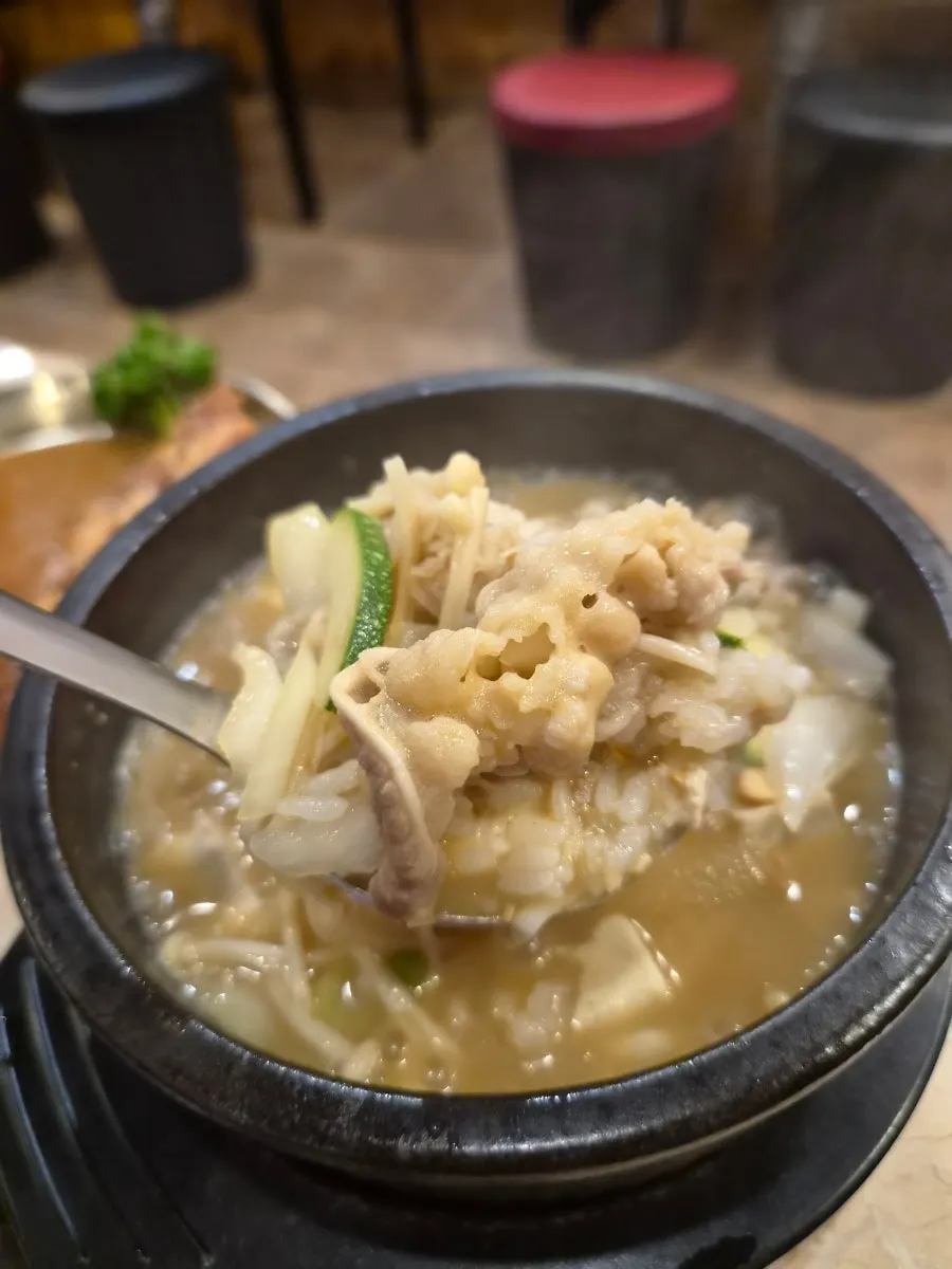 A spoonful of doenjang sulbap with beef and tofu