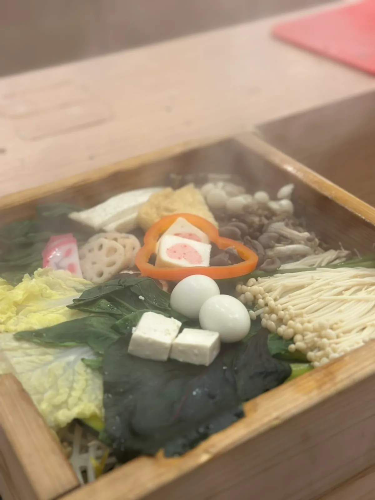 Napa cabbage, bok choy, and mushrooms piled over bean sprouts
