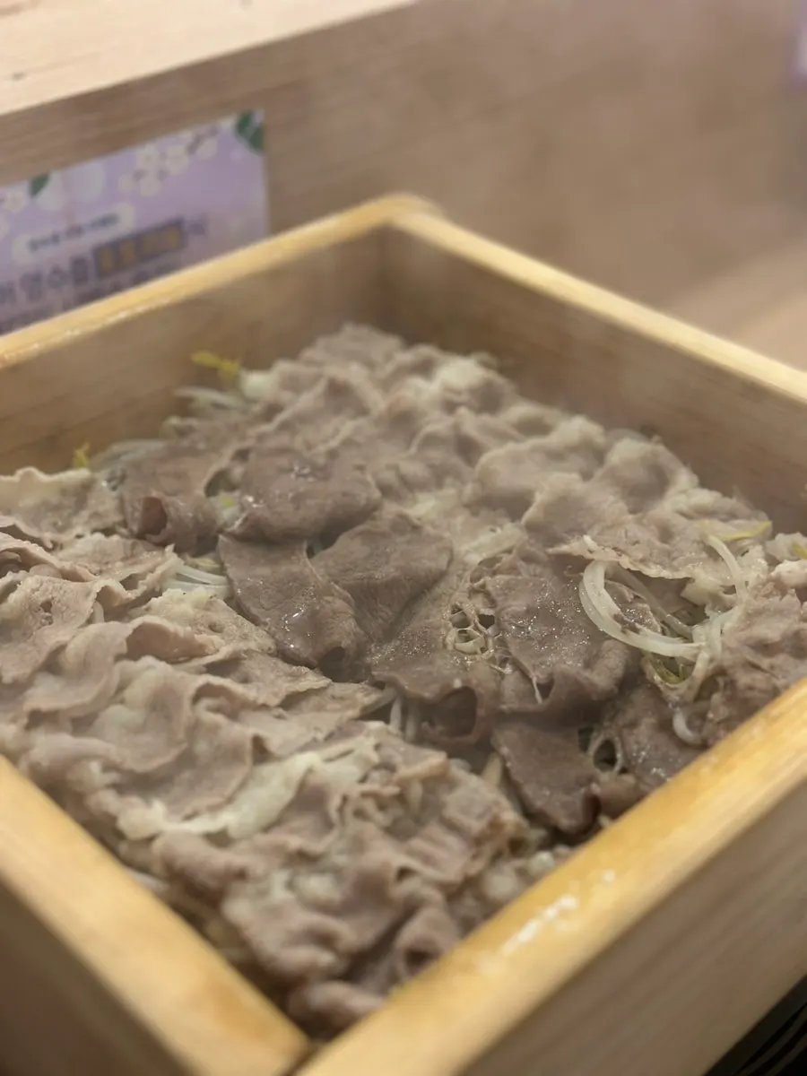 Close-up of steamed meat and bean sprouts