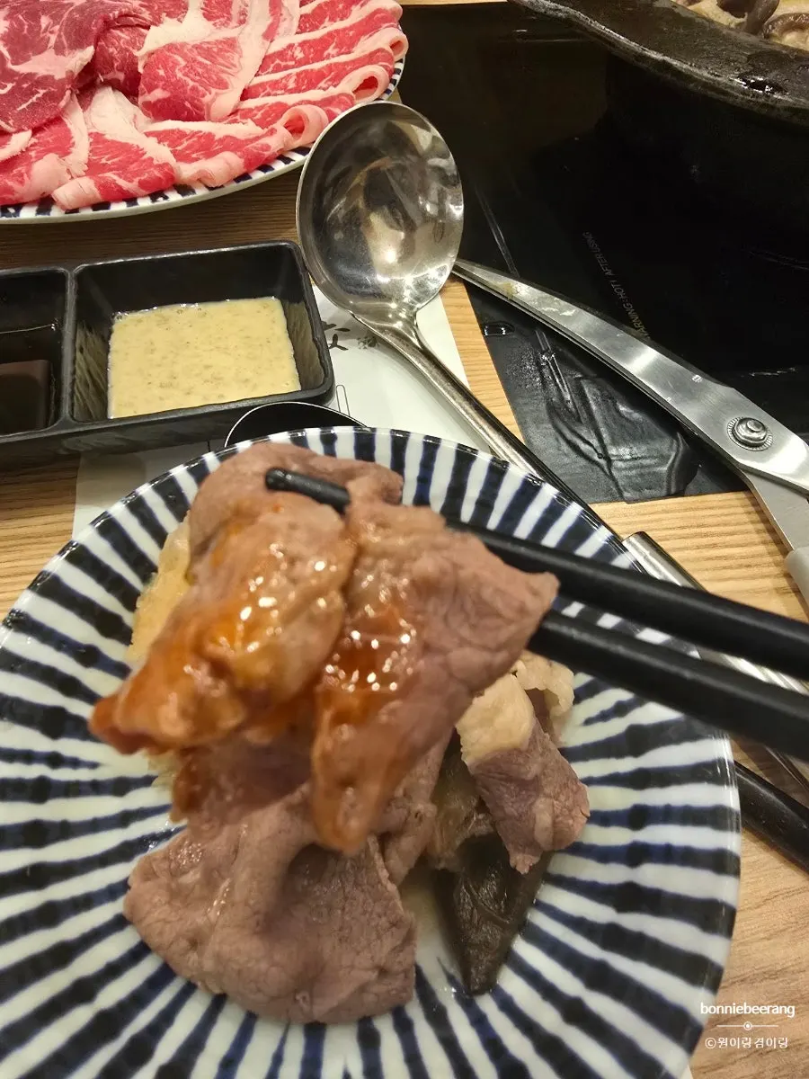 Shabu-shabu beef dipped in sauce