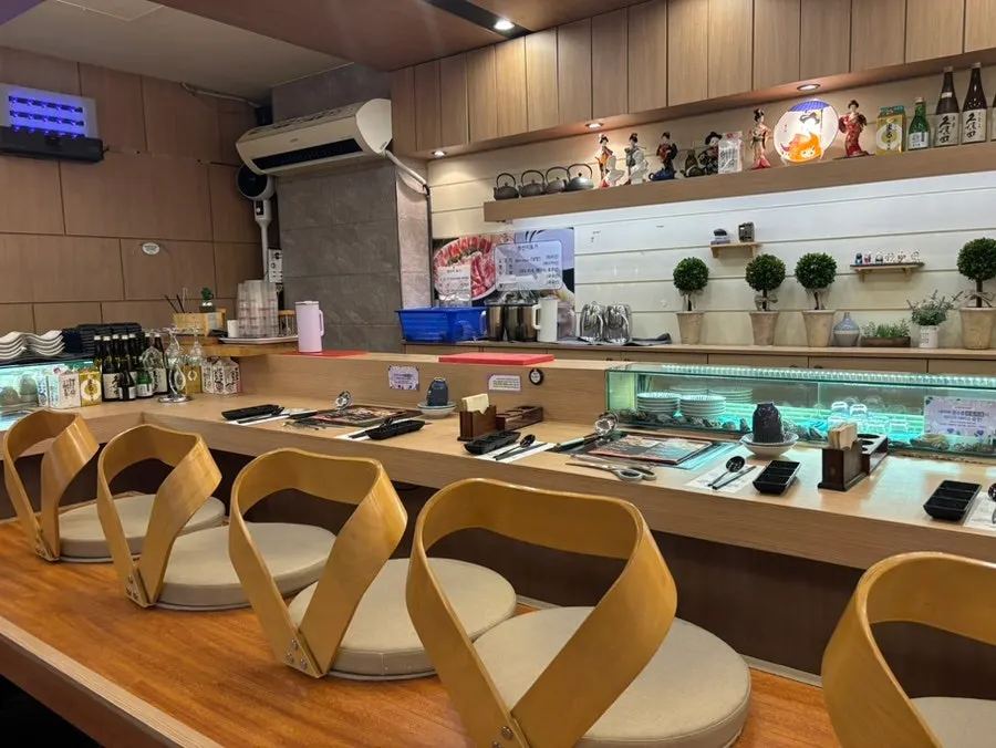 Restaurant interior with counter and table seating