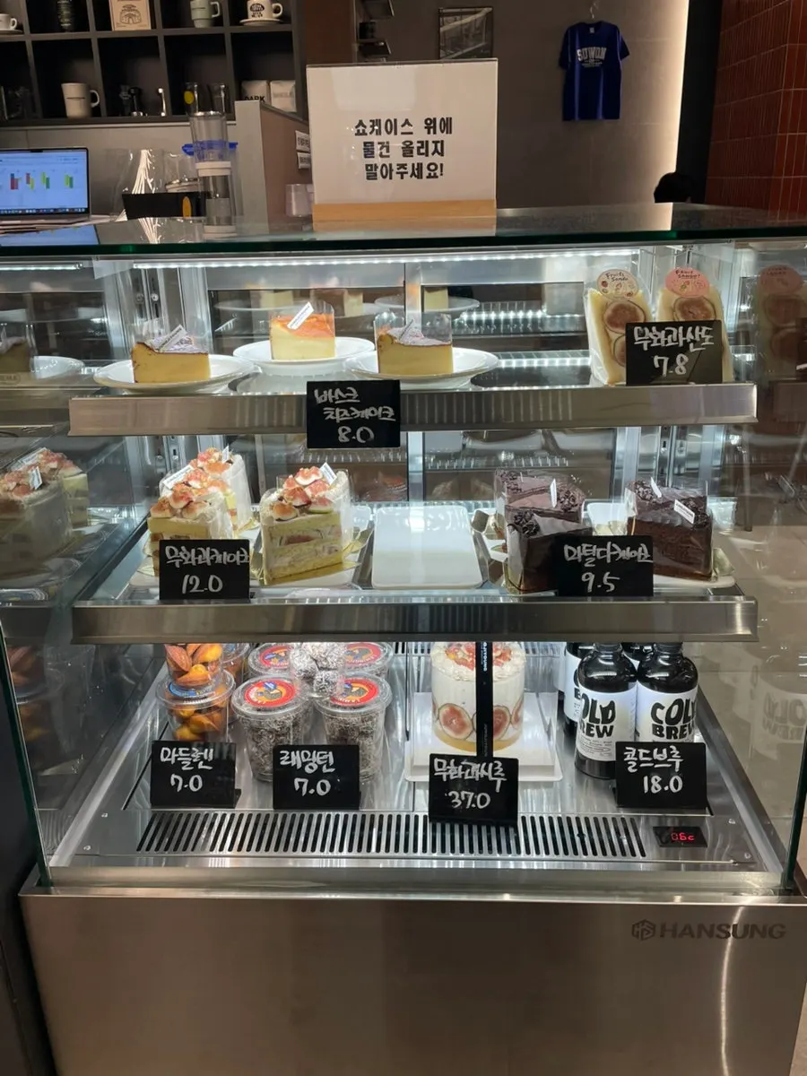 Showcase displaying slice cakes and fig sourdough