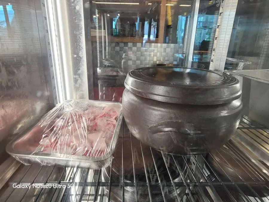 Jars and meat inside the aging room