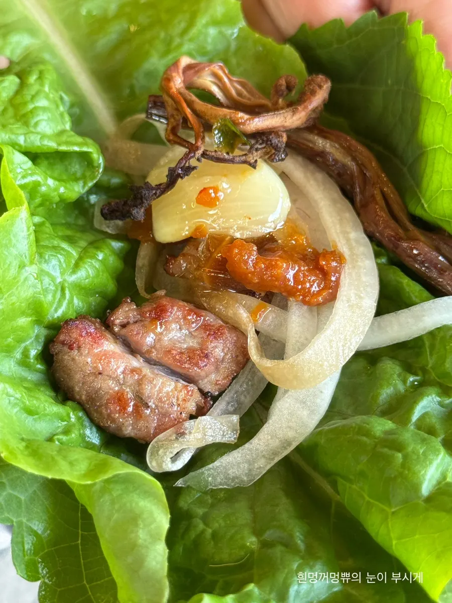 A wrap of pork belly with bracken