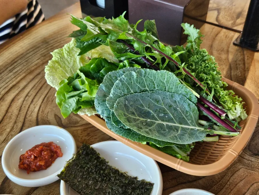 A plate full of assorted wrap vegetables