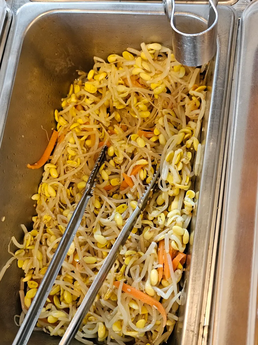 Various side dishes gathered from the self-serve bar